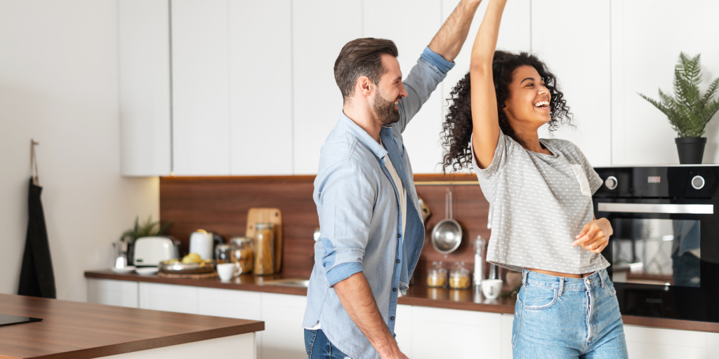 couple dancing in a kitchen