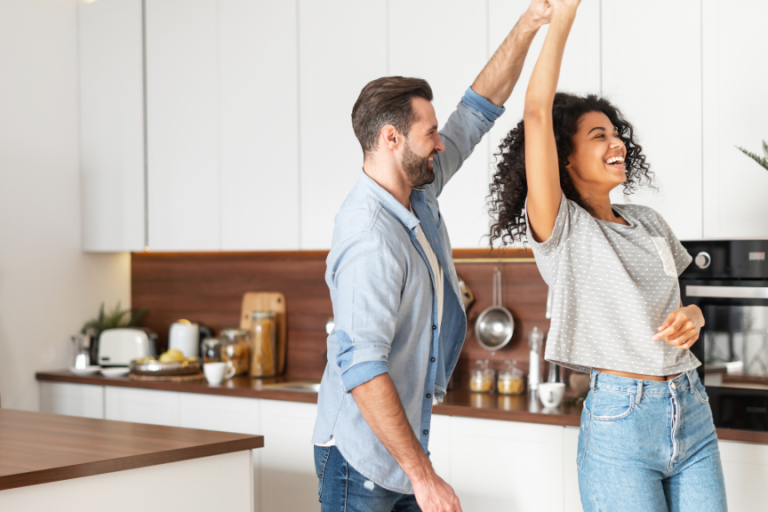 couple dancing in a kitchen