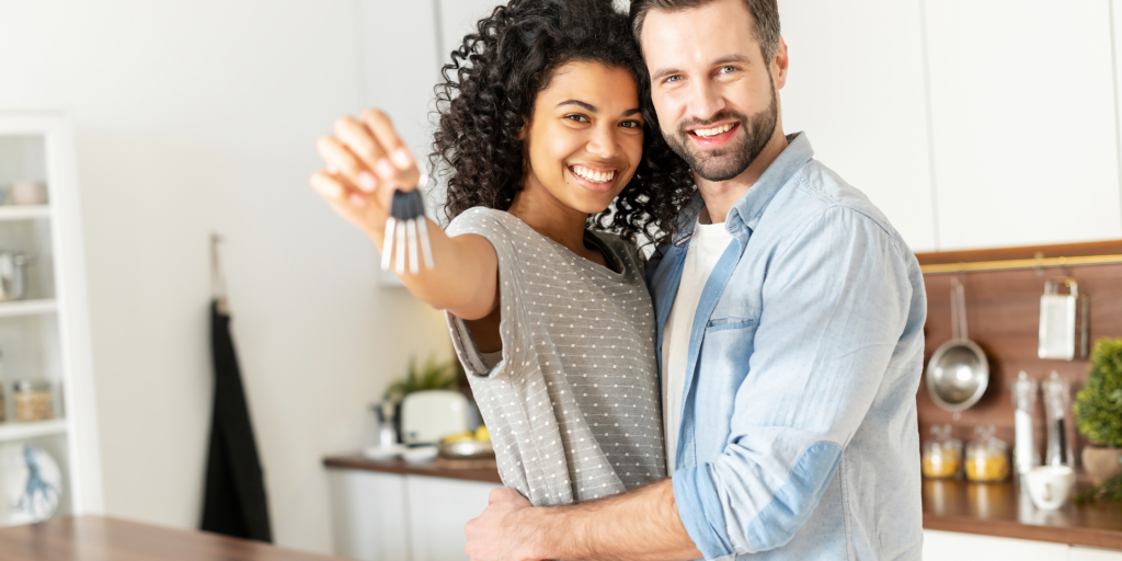 couple with keys to their first home