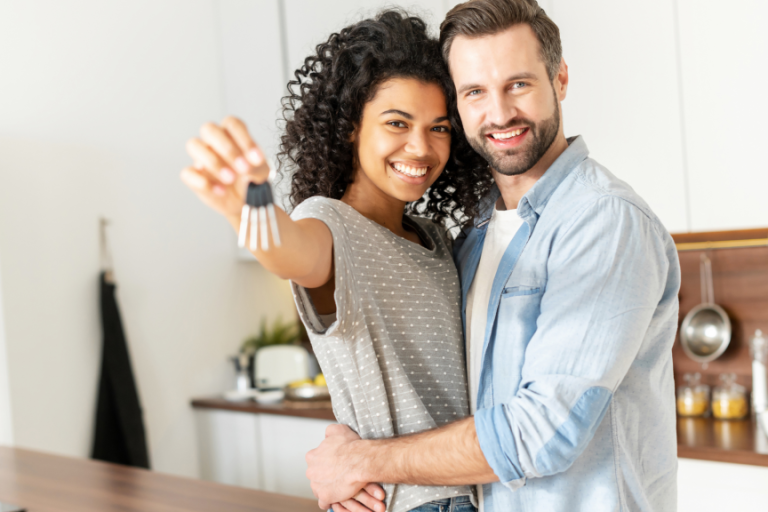 couple with keys to their first home