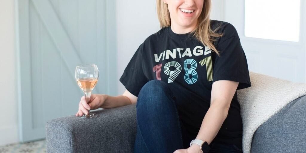 rebecca cooper traynor sitting on couch