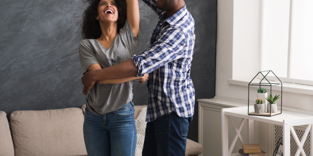 couple dancing in their living room