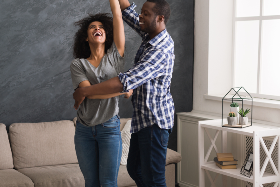 couple dancing in their living room