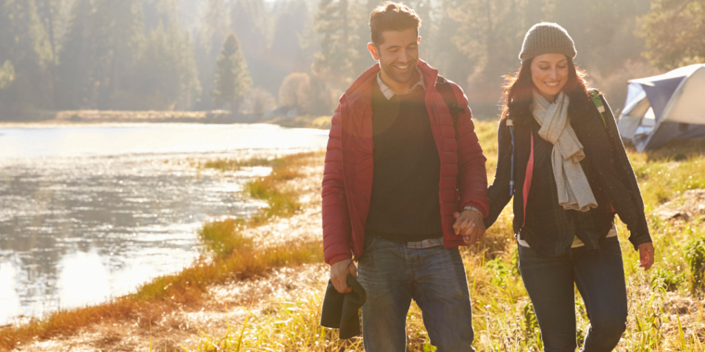 Couple holding hands in the Fall