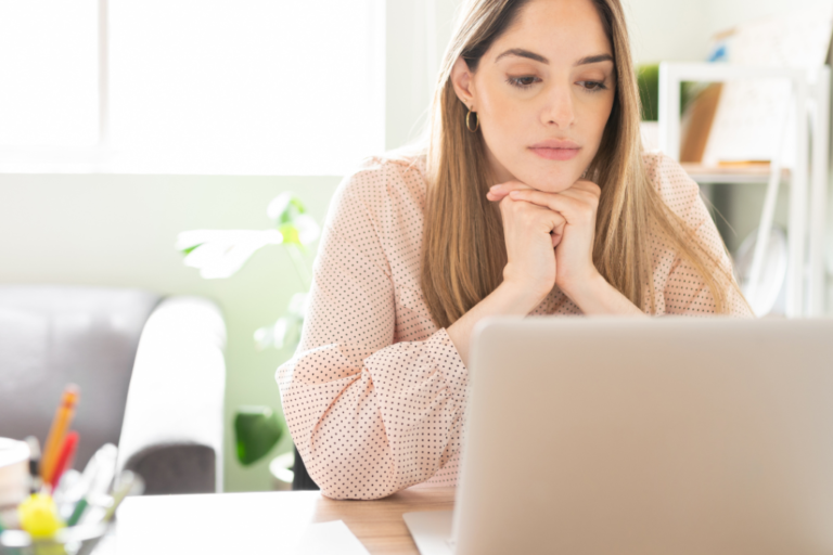 women staring at her computer screen