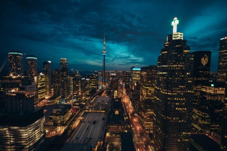 Stunning Toronto cityscape at night featuring the illuminated CN Tower and vibrant urban skyline.