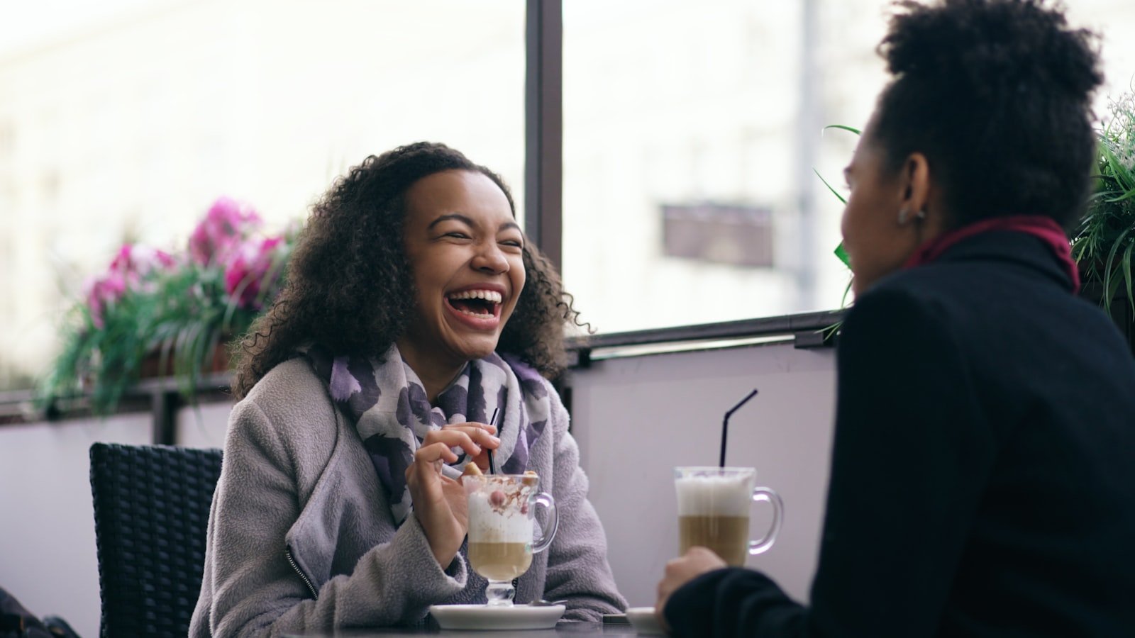 Two people talking and laughing together.
