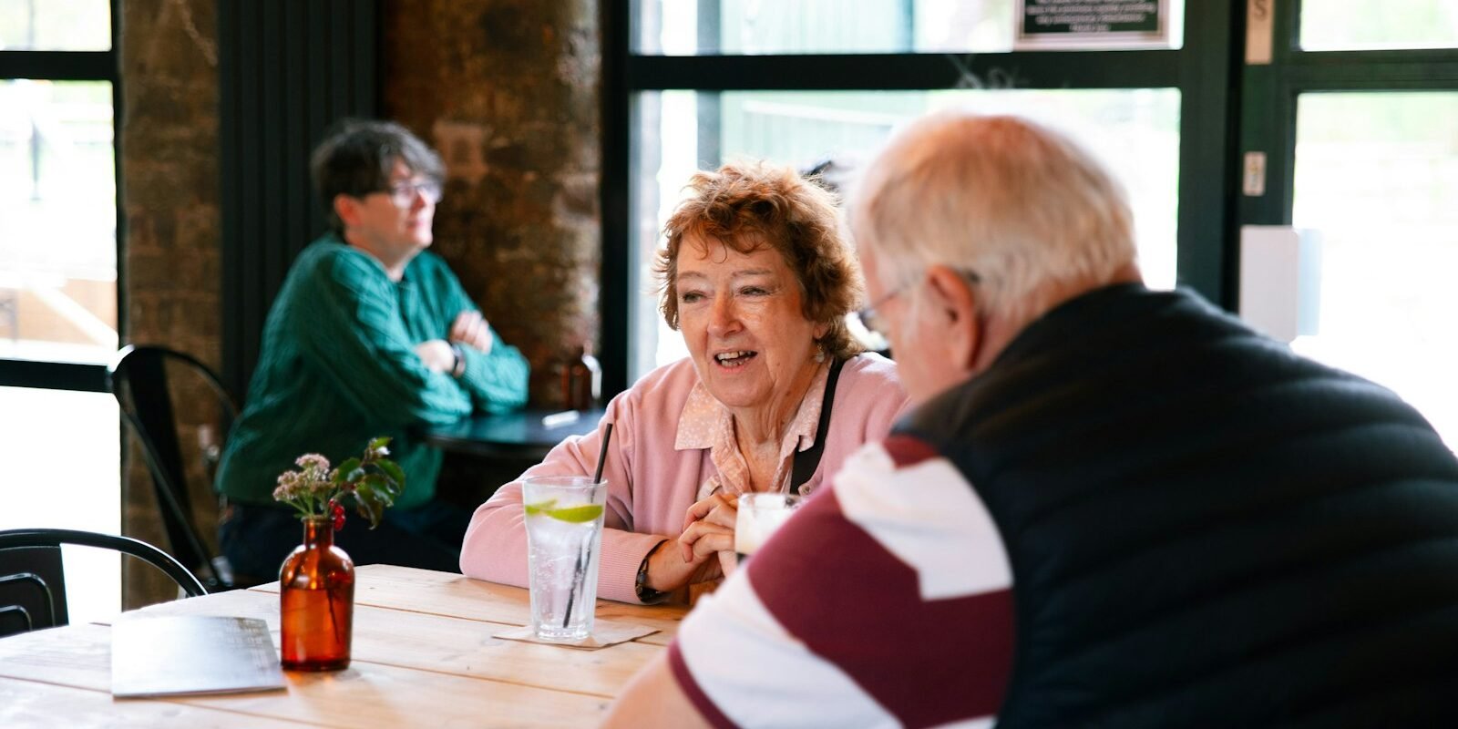 Why First Dates Feel Like Interviews Image Two people relaxed and laughing on a first date.